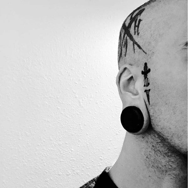 Guy With Dagger On Side On Face Tattoo