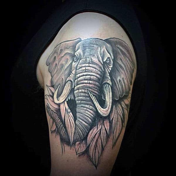 Guy With Elephant And Leaves Tattoo On Arms