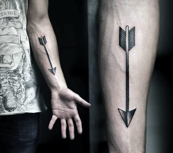 Guy With Extremely Pointy Arrowhead Tattoo On Forearms