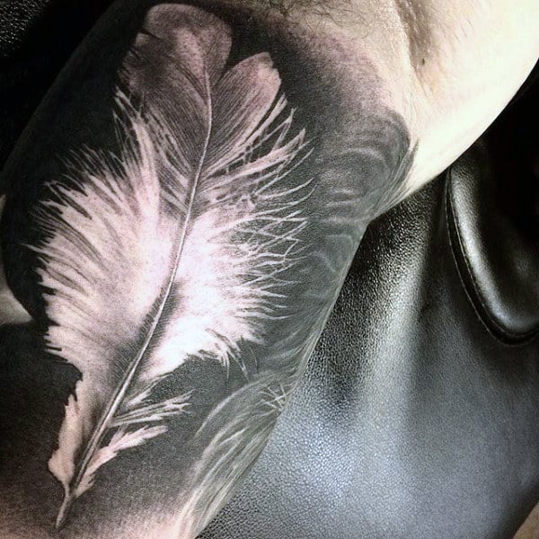 Guy With Gorgeous Black And White Feather Tattoo On Forearms