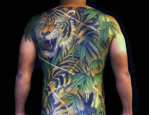 Guy With Green Foliage And Hungry Tiger Tattoo Full Back
