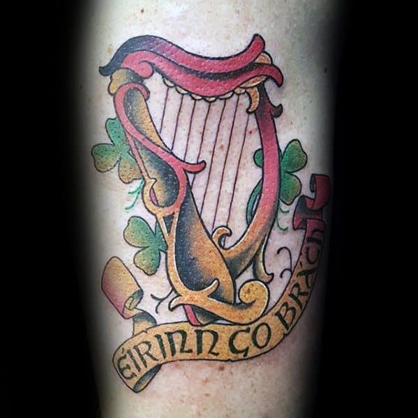 Guy With Harp Tattoo Design Celtic Banner With Three Leaf Clovers On Forearm