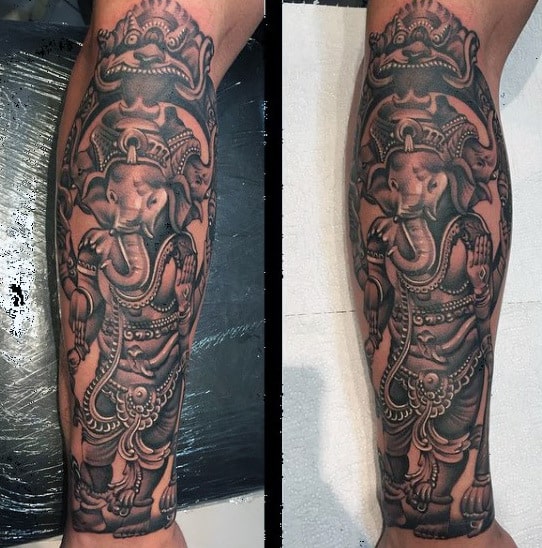 Guy With Hindu Elephant God Tattoo On Forearm