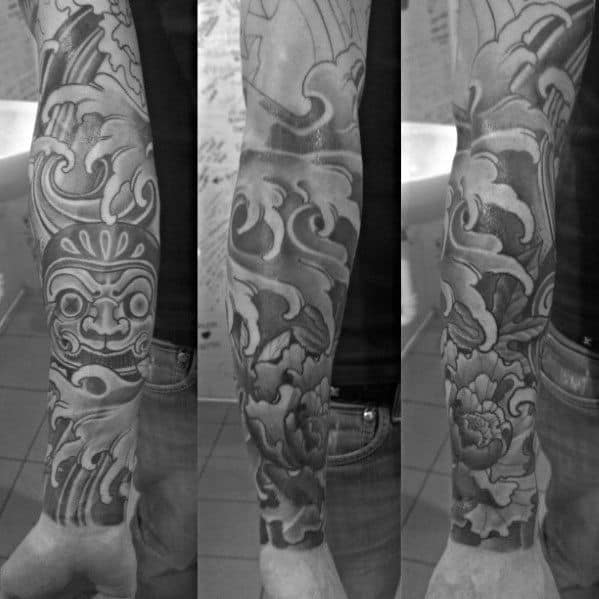 Guy With Japanese Wave Sleeve Tattoo