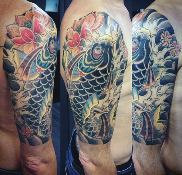 Guy With Koi Fish Flower Tattoo On Arm