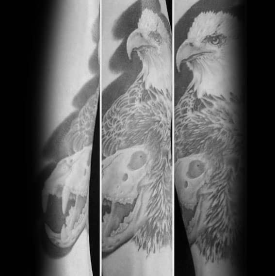 Guy With Lion Skull Bald Eagle Forearm Tattoo