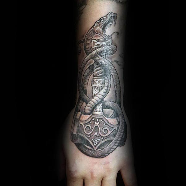 Guy With Lower Forearm And Wrist Tattoo Of Mjolnir
