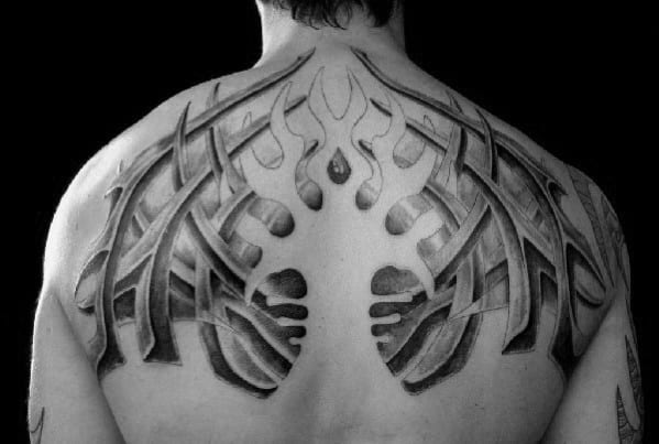 Guy With Negative Space 3d Tribal Tattoo On Upper Back