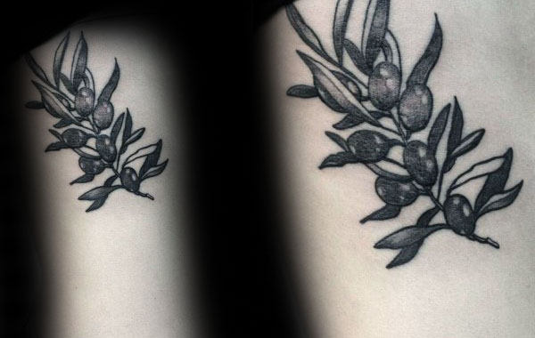 Guy With Olive Branch Thigh Tattoo