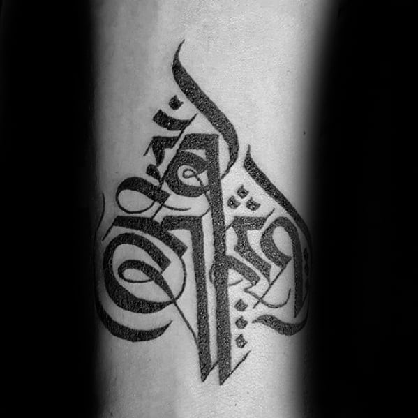 Guy With Sanskrit Tattoo Design On Inner Forearm With Black Ink