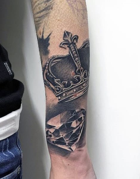 Guy With Shiny Crown And Diamond Tattoo Forearms