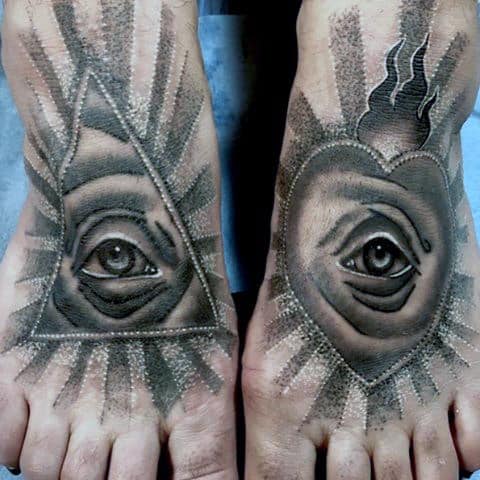 Guy With Shiny Eye Tattoo On Foot