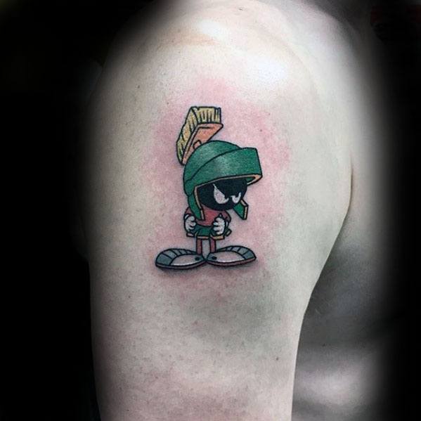 Guy With Small Simple Marvin The Martian Upper Arm Tattoo.