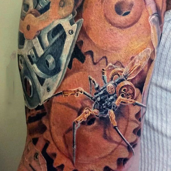 Guy With Steampunk Insect Tattoo On Arms