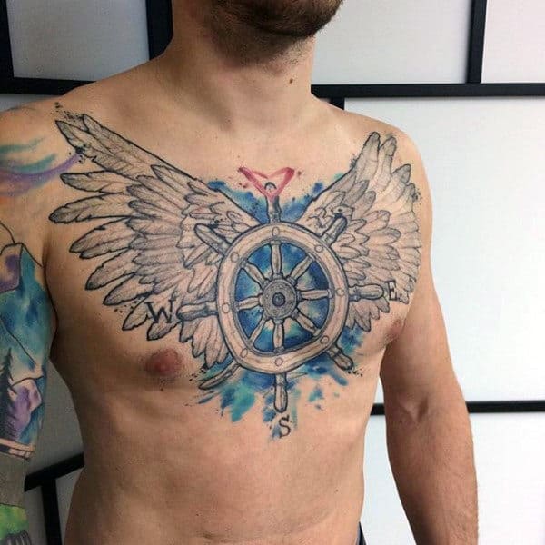 Guy With Striking Feathers Watercolor Tattoo On Chest