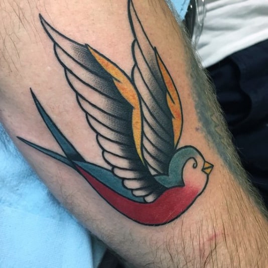 Guy With Sweet Sparrow Tattoo On Calves