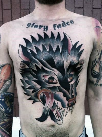 Guy With Traditonal Wolf Tattoo On Chest With Tounge Hanging Out