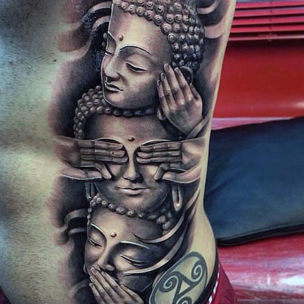 Guy With Tri Buddha Wisdom Tattoo On Side Ribs