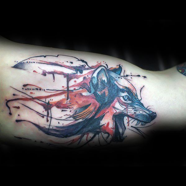 guy-with-wolf-inner-arm-bicep-watercolor-tattoo-design
