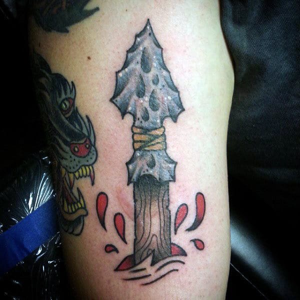 Guy With Wooden Handle Arrowhead Tattoo On Arms