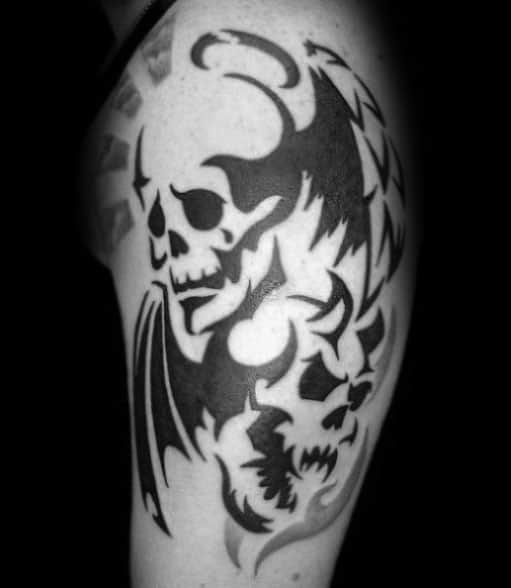 Guys Arm Tattoos With Tribal Skull Design