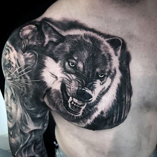 Guys Cool Chest Tattoo Of Agressive Wolf With Shaded Black And Grey Design