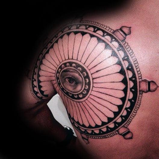 Guys Dharma Wheel Arm And Shoulder Tattoo With Eye Design