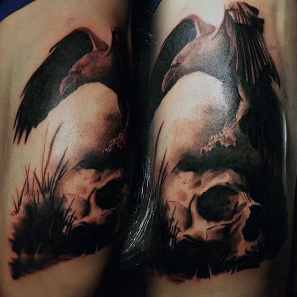 Guys Knees Brownish Raven And Skull Tattoo