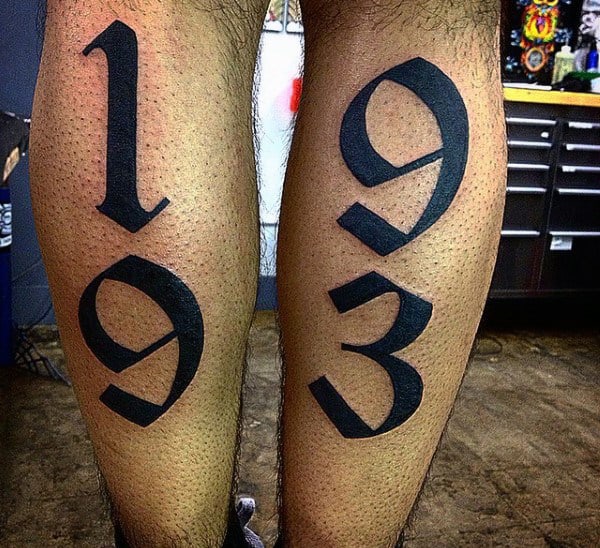 Guys Old English Font Back Of Leg Birth Year Tattoo Designs