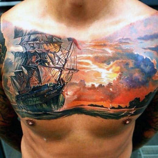 Guys Sailing Ship In Ocean With Sunset Sky Chest Tattoo