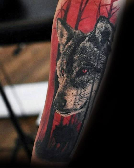 Guys Sick Wolf In Forest Red And Black Ink Tattoo Deisgns On Forearm