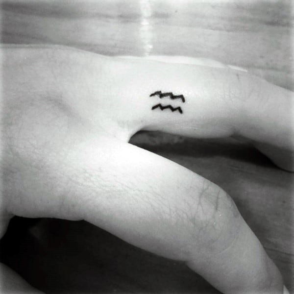 Guys Small Simple Tattoo Of Aquarius Astrological Sign On Fingers