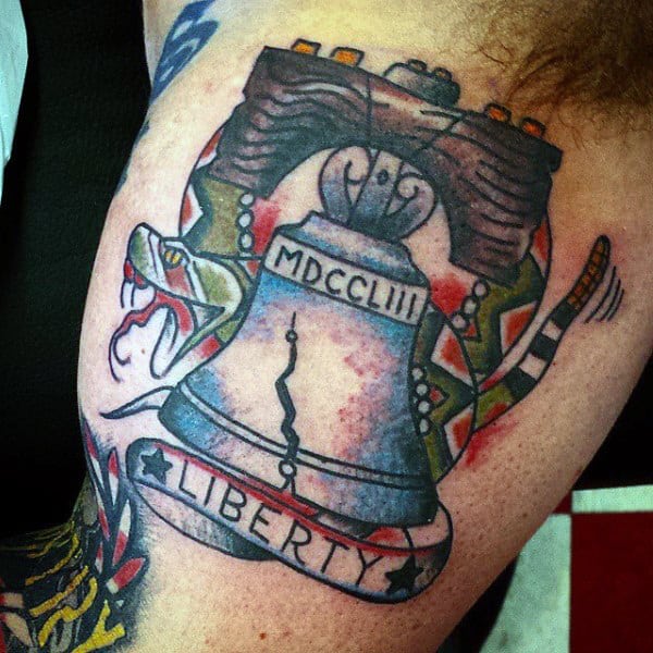 Guys Snake And Liberty Bell Tattoo On Bicep