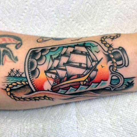 guys-sunset-ship-in-a-bottle-traditional-outer-forearm-tattoo-inspiration