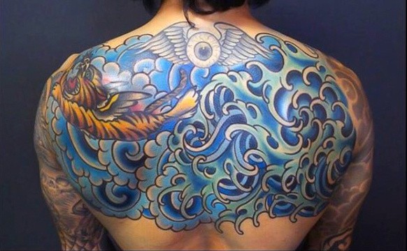 Guy's Tattoos Of Ocean Waves On Back