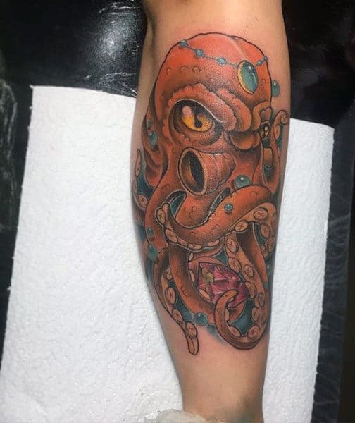 Guy's Tattoos Of Octopus On Forearm