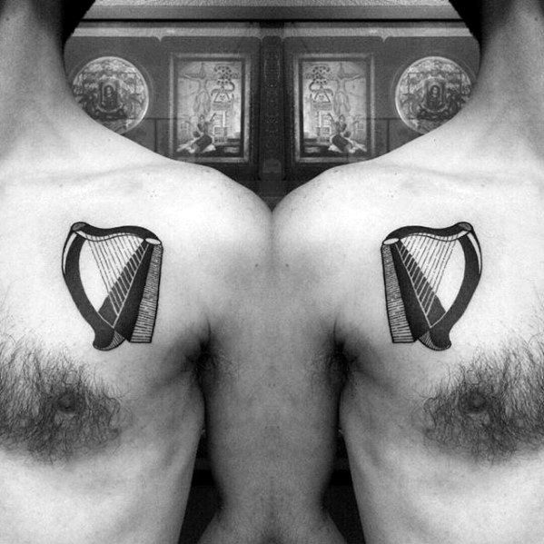 Guys Tattoos With Harp Design Upper Chest