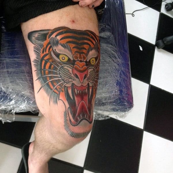 Guys Thigh Tattoo Of Traditional Roaring Tiger