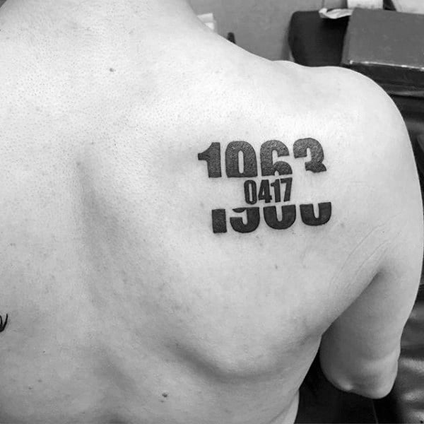 Guys Unique Numbers Negative Space Tattoo On Shoulder Blade