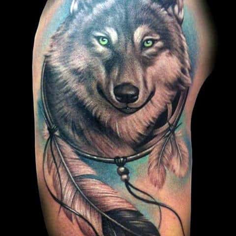 Guys Upper Arm Realistic Wolf And Dreamcatcher Tattoo Design Ideas