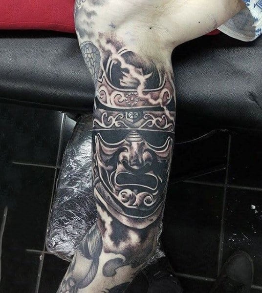 Guys Upper Arm Traditional Shaded Samurai Mask Tattoo