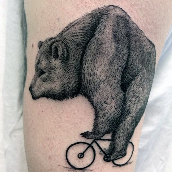 Hairy Beast On Small Bicycle Tattoo For Men On Arms