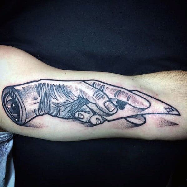 Hand Holding Ace Of Spaces Playing Card Tattoo On Mans Inner Arm