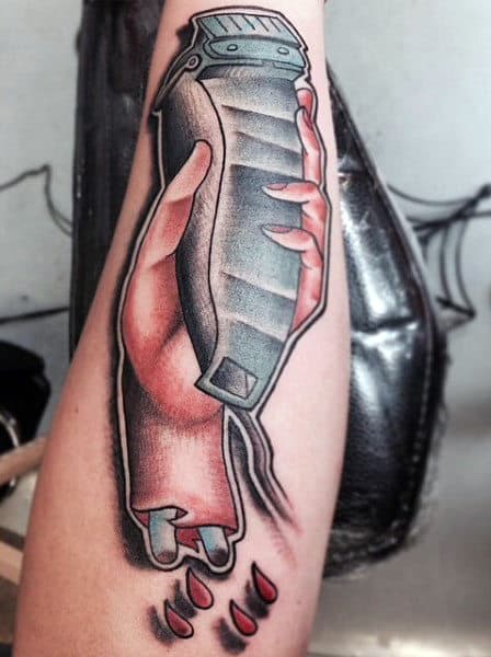 Hand Holding Clipper Barber Tattoo With Bones For Men.