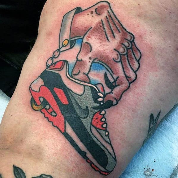 Hand Picking Up Nike Sneaker Mens Leg Tattoo