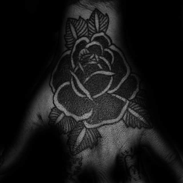 Hand Tattoo On Man Of Black Rose With Old School Design