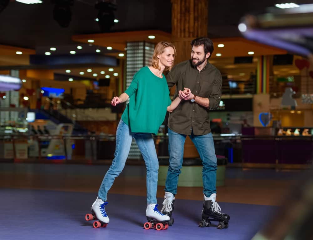 happy couple roller skating together