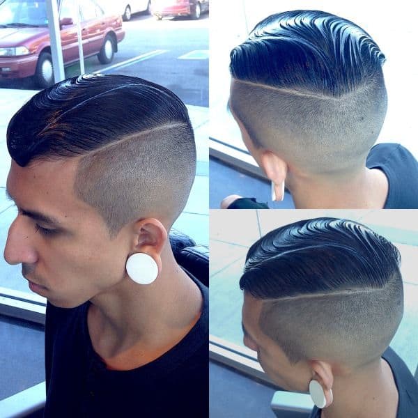 A top fade haircut with hair on top styled smooth using mouse