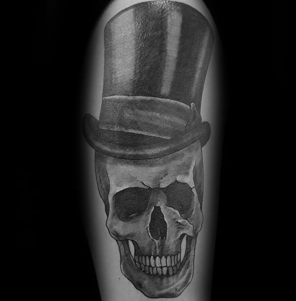 Heavily Shaded Black And Grey Arm Skull With Top Hat Mens Tattoo Ideas