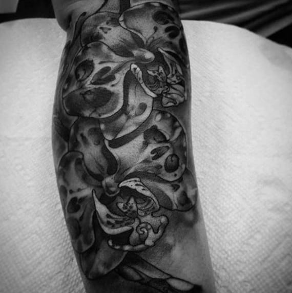 Heavily Shaded Orchid Black And Grey Flower Tattoo On Male